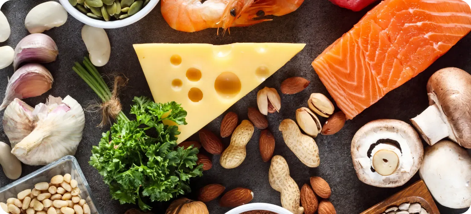 Zinc-rich foods including cheese, salmon and nuts